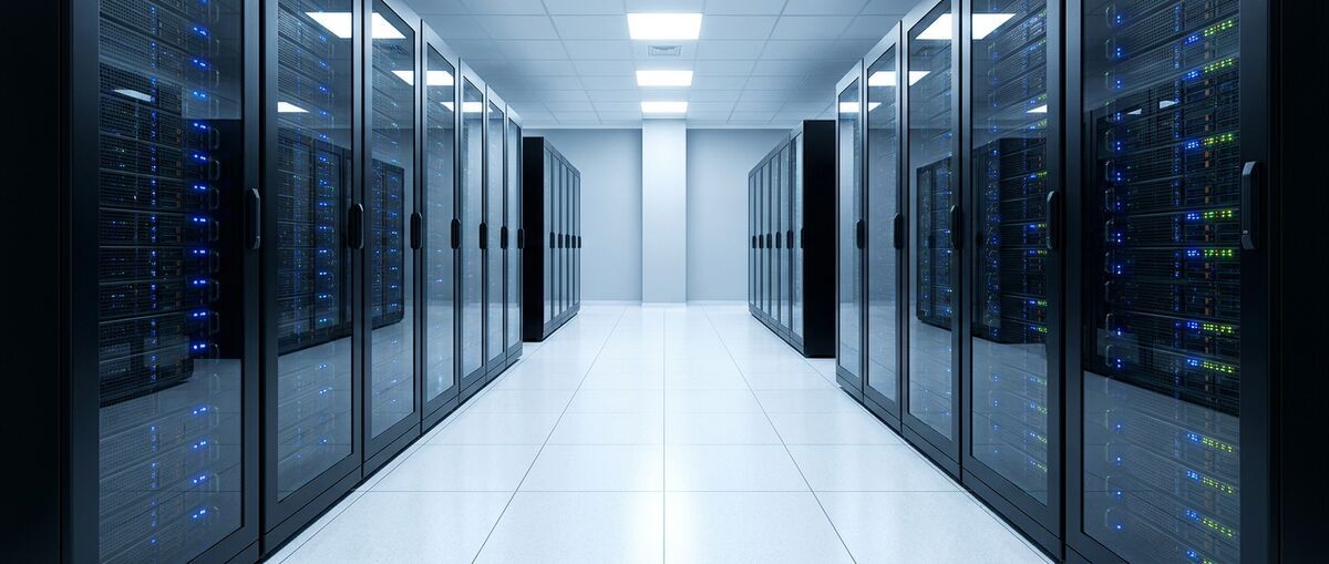 Sterile data centre corridor lined with server racks and indicator lights